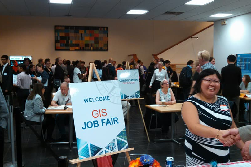 GISMO GIS Job Fair at Hunter College entrance with Amy Jeu greeting guests